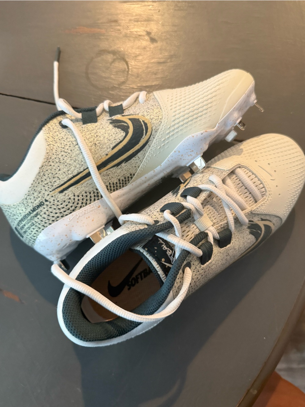 Nike women White and green metal Cleats, new with no tag